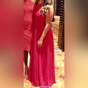 Stunning floor length red dress with criss cross tie back. Worn once